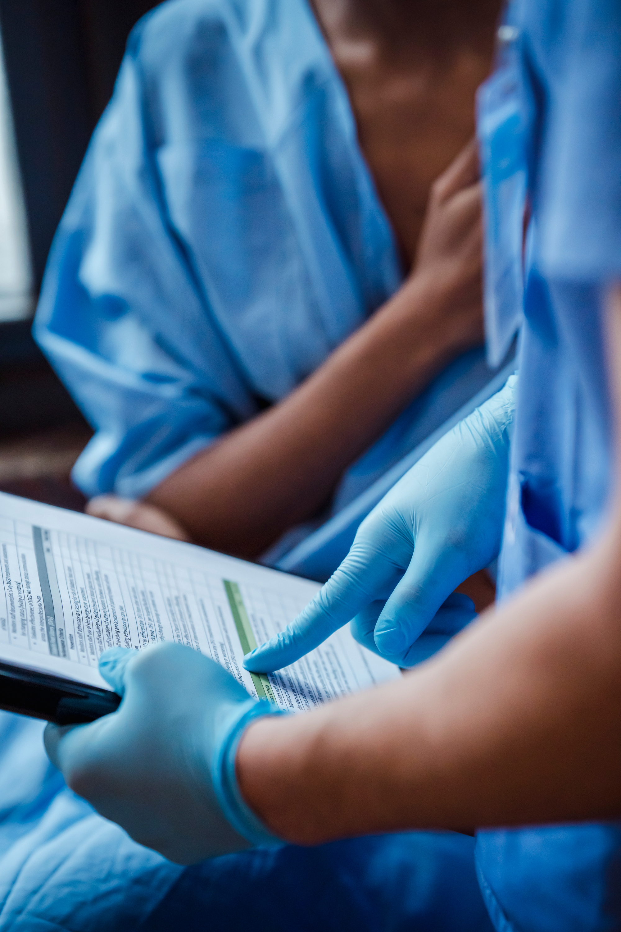 Nurse demonstrating diagnosis to patient